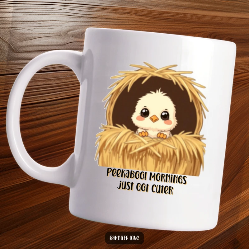 Funny Mug showcasing a fluffy baby chick with wide, curious eyes peeking out from a straw bale, radiating cuteness and farm charm.