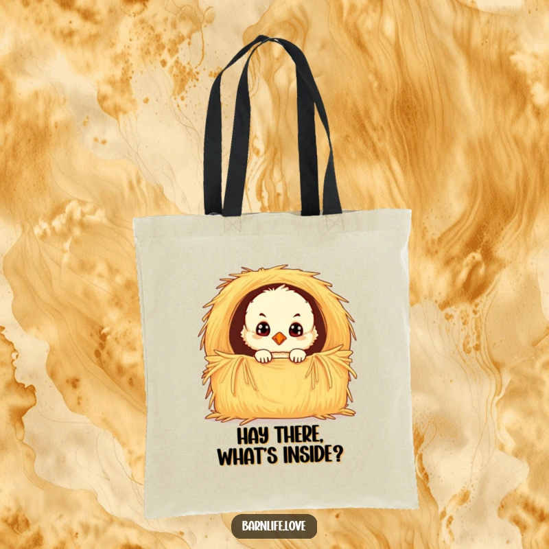 Funny chick tote bag showcasing a fluffy baby bird with wide, curious eyes peeking from a hay bale, ideal for carrying groceries or daily essentials.